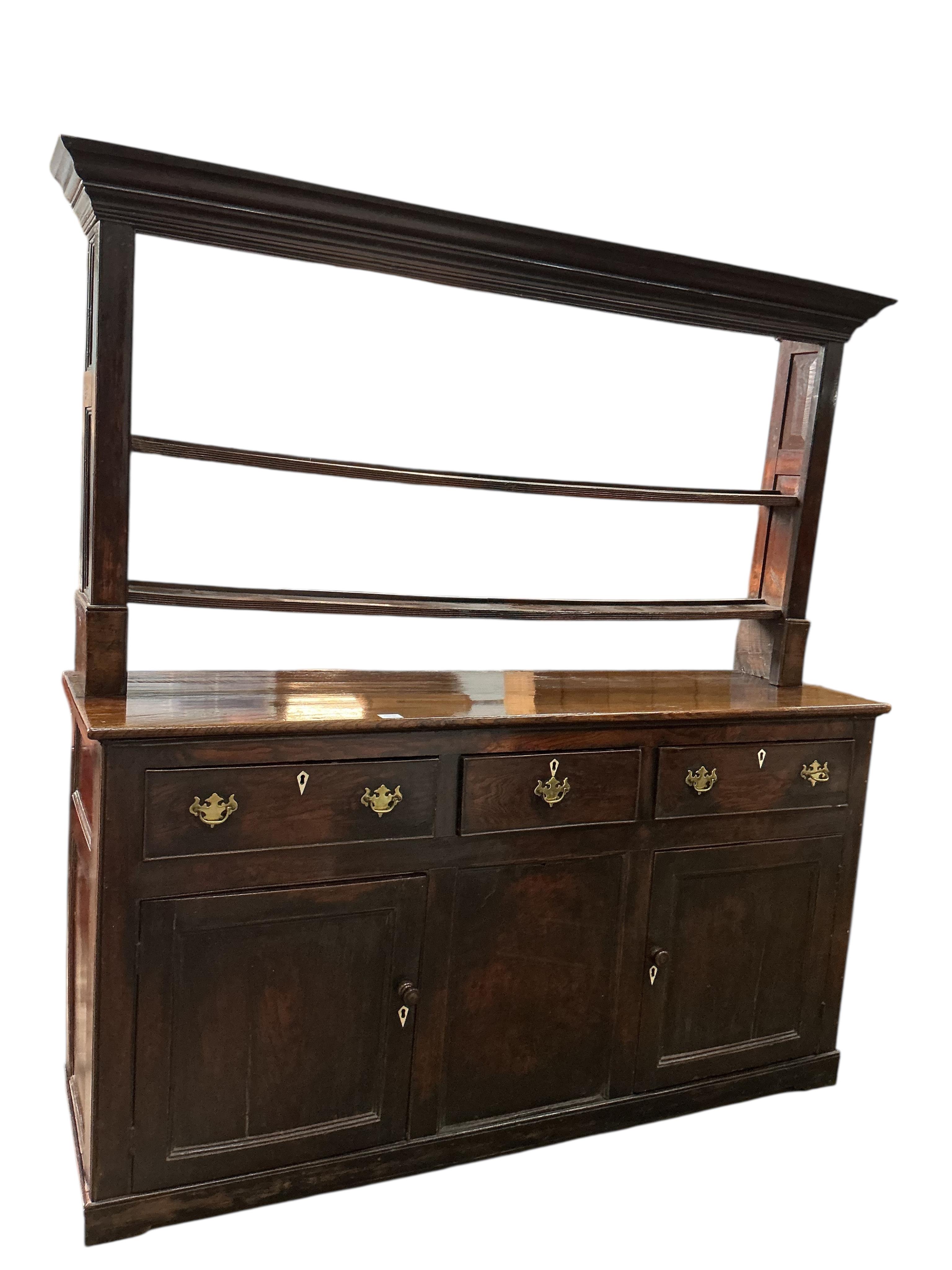 An 18th century oak dresser with open rack, (back boards wormed), width 170cm, depth 47cm, height 182cm